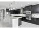 Modern kitchen with stainless steel appliances and granite countertops at 19433 Whispering Brook Dr, Tampa, FL 33647