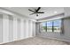 Spacious bedroom with gray walls and wood-look floors at 19433 Whispering Brook Dr, Tampa, FL 33647