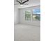 Simple bedroom with neutral carpeting and large windows at 19433 Whispering Brook Dr, Tampa, FL 33647