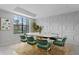 Bright dining room features a large window and stylish geometric wall detail at 19433 Whispering Brook Dr, Tampa, FL 33647