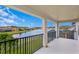 Covered balcony overlooking a lake and neighborhood at 19433 Whispering Brook Dr, Tampa, FL 33647