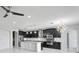 Open concept kitchen with dark cabinetry and a large island at 19433 Whispering Brook Dr, Tampa, FL 33647