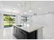 Modern kitchen with island, stainless steel appliances, and granite countertops at 19433 Whispering Brook Dr, Tampa, FL 33647