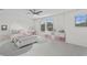 Charming bedroom with a white bed and pink accents at 19433 Whispering Brook Dr, Tampa, FL 33647