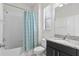 Clean bathroom with shower/tub combo and granite countertop at 19433 Whispering Brook Dr, Tampa, FL 33647