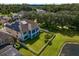 Aerial view of house with fenced backyard and lake view at 19433 Whispering Brook Dr, Tampa, FL 33647