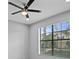 Bright bedroom with a large window and ceiling fan at 19433 Whispering Brook Dr, Tampa, FL 33647