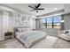Main bedroom with ceiling fan and large window at 19433 Whispering Brook Dr, Tampa, FL 33647