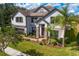 Two story home with stone accents and landscaping at 19433 Whispering Brook Dr, Tampa, FL 33647