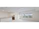 Spacious bonus room with balcony access and three windows at 19433 Whispering Brook Dr, Tampa, FL 33647