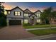 Two-story home with brick driveway and landscaping at 19433 Whispering Brook Dr, Tampa, FL 33647