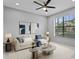 Modern living room with comfy sofa and large window at 19433 Whispering Brook Dr, Tampa, FL 33647