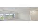 Bright bedroom with three windows and access to a balcony at 19433 Whispering Brook Dr, Tampa, FL 33647