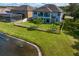 Two story home with fenced backyard, featuring a large grassy area at 19433 Whispering Brook Dr, Tampa, FL 33647