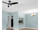 Living room with light blue walls and dark wood floors at 3166 Lake Pine S Way # A2, Tarpon Springs, FL 34688