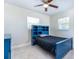 Bright bedroom with a blue bed frame and built-in shelving at 1045 West Ave, Clearwater, FL 33755