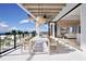 Spacious ocean view balcony with dining area and access to living room at 10126 Gulf Blvd # Ph1, Treasure Island, FL 33706