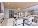 Open living space with fireplace and access to kitchen and dining areas at 10126 Gulf Blvd # Ph1, Treasure Island, FL 33706