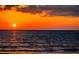 Orange sunset over calm ocean waters at 10126 Gulf Blvd # Ph1, Treasure Island, FL 33706