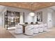 Elegant dining area with wine storage and modern light fixture at 10126 Gulf Blvd # Ph1, Treasure Island, FL 33706