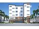 Modern building exterior, The Pearl, with parking and landscaping at 10126 Gulf Blvd # Ph1, Treasure Island, FL 33706