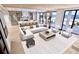 Modern living room with ocean view and open concept floor plan at 10126 Gulf Blvd # Ph1, Treasure Island, FL 33706