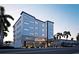 Modern building exterior, The Pearl, with parking and landscaping at 10126 Gulf Blvd # Ph1, Treasure Island, FL 33706