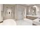 Bathroom with freestanding tub, walk-in shower, and double vanity at 10126 Gulf Blvd # Ph1, Treasure Island, FL 33706