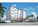 Modern building exterior, The Pearl, with parking and landscaping at 10126 Gulf Blvd # Ph1, Treasure Island, FL 33706