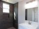 Modern bathroom featuring a slate shower, hexagon tile floor, and a vanity sink at 1010 E Flora St, Tampa, FL 33604