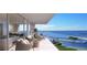 Spacious balcony with comfortable seating, offering stunning views of the marina and waterfront at 5701 Bowen Daniel Dr. # 504, Tampa, FL 33616