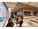 Well-equipped gym with modern exercise machines and floor-to-ceiling windows at 5701 Bowen Daniel Dr. # 504, Tampa, FL 33616