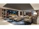 Home theater with comfortable seating, large screen, and elegant decor at 5701 Bowen Daniel Dr. # 504, Tampa, FL 33616