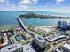 Beautiful aerial view showcasing the coastline, bridge, and surrounding buildings in a coastal community at 800 S Gulfview Blvd # 903, Clearwater Beach, FL 33767