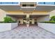 Inviting building entrance with professional landscaping, clean pavers and clear signage for Shipmaster Condominiums at 800 S Gulfview Blvd # 903, Clearwater Beach, FL 33767