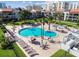 Aerial view of a large community pool and hot tub with comfortable lounge area at 800 S Gulfview Blvd # 903, Clearwater Beach, FL 33767