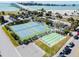 Aerial view of community tennis courts and recreational areas near the bay and bridge at 800 S Gulfview Blvd # 903, Clearwater Beach, FL 33767
