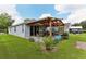 Home exterior showcasing backyard patio and pergola at 6228 Dainty Bess Ct, Land O Lakes, FL 34639