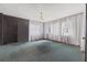 Living room with dark walls, neutral carpeting and sheer curtains at 1515 Park N St, St Petersburg, FL 33710