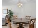 Charming dining area with glass-top table and four chairs at 220 Belleview Blvd # 702, Belleair, FL 33756