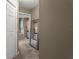 View down hallway to bathroom with a large mirror and bathtub at 9295 Butler Blvd, Weeki Wachee, FL 34613