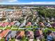 Aerial view of a residential neighborhood with many homes at 10718 Standing Stone Dr, Wimauma, FL 33598