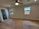 Main bedroom with hardwood floors and ceiling fan at 1010 E Flora St, Tampa, FL 33604