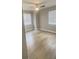 Spacious bedroom with neutral walls and light wood-look floors at 3002 W Cleveland St # E1, Tampa, FL 33609
