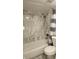 Bathroom with marble tile, shower/tub combo and gray shower curtain at 3002 W Cleveland St # E1, Tampa, FL 33609