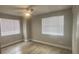 Spacious bedroom with two windows and light flooring at 3002 W Cleveland St # E1, Tampa, FL 33609