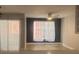 Living room with hardwood floors, ceiling fan, and large windows at 3002 W Cleveland St # E1, Tampa, FL 33609