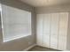 Bright bedroom with large closet and window blinds at 3002 W Cleveland St # E1, Tampa, FL 33609