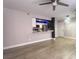 Open concept living room featuring a pass-through kitchen and neutral color palette at 3002 W Cleveland St # E1, Tampa, FL 33609