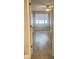 Bright bedroom with light wood flooring and a large window at 3002 W Cleveland St # E1, Tampa, FL 33609